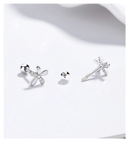 Close-up of 925 silver four-petal flower earrings with zircon stones and screw ball backings