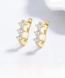 Macro shot of S925 sterling silver hallmark on gold-plated zircon stud earrings