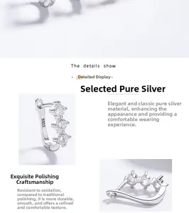 Macro view of S925 sterling silver hoop earrings with clear cubic zirconia stones and S925 stamp