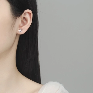 Elegant 925 sterling silver five-petal flower stud earring with zircon inlay on ear