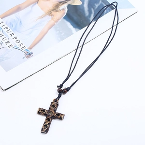 Vintage resin cross pendant necklace with hollow patterns and adjustable black cord