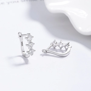 925 sterling silver hoop earrings with three round zircon stones on white background