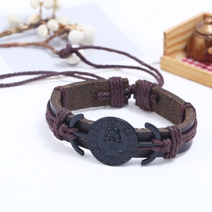 Bracelet pour homme en cuir tressé vintage avec breloque crâne et fermeture ajustable