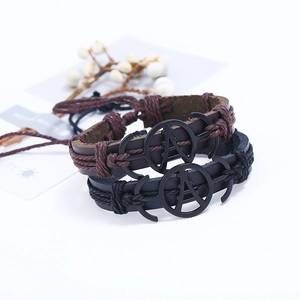 Vintage braided leather bracelets with Eiffel Tower metal charms in black and brown