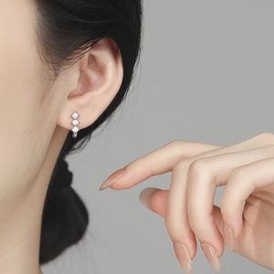 Elegant 925 sterling silver huggie earrings featuring three round-cut sparkling zircons
