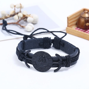 Bracelet pour homme en cuir tressé à la main avec badge tête de mort et cordon réglable noir