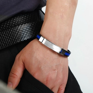 Men's titanium stainless steel bracelet with blue and black silicone strap on wrist