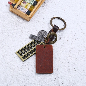 Retro handmade braided cowhide keychain with a vintage metal abacus and leather pendant