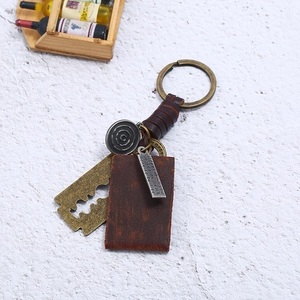 Retro handmade braided leather keychain with vintage bronze alloy blade pendant