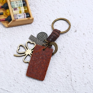 Handmade punk braided leather keychain with vintage four-leaf clover and inspirational tags
