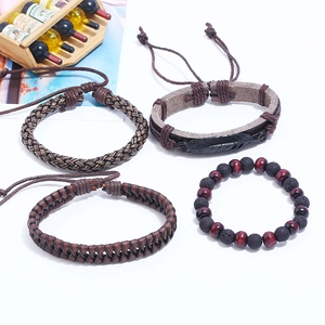 Retro DIY 4-piece set of men's woven brown leather bracelets with metal feather charm