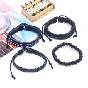 Set of four men's bohemian braided leather bracelets and black bead wristbands