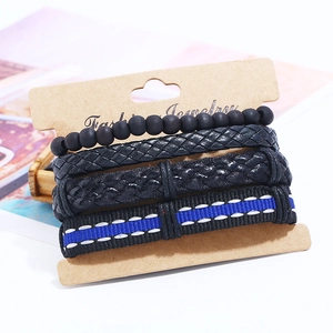 Set of four men's black braided leather and matte bead bracelets on a display card