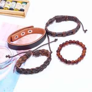 Vintage 4-piece set of woven brown leather bracelets with metal snaps and elastic beads