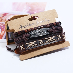 Vintage leather braided bracelet set with alloy feather charms and wooden beads on card