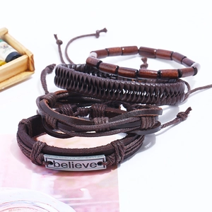 Vintage braided brown leather bracelet set with wooden beads and engraved Believe metal plate