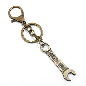Detail view of the bronze alloy wrench keychain with engraved tool numbers and lobster clasp