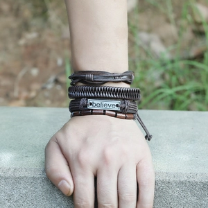 Retro four-piece braided leather bracelet set with wooden beads and believe metal plate