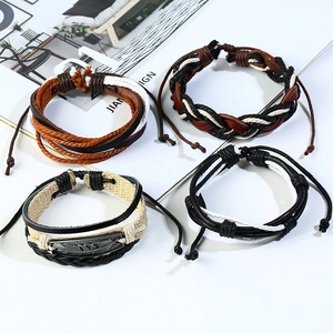 Set of four vintage braided leather bracelets for men featuring leaf charm and adjustable cords
