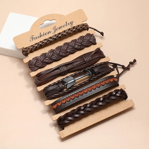 Set of 6 vintage layered leather bracelets for men featuring woven cords and metal charms