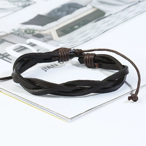 Detail of a dark brown braided leather bracelet with adjustable wax rope sliding knot