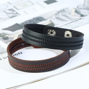 Minimalist leather bracelet set with dual stitching and adjustable metal snap buttons