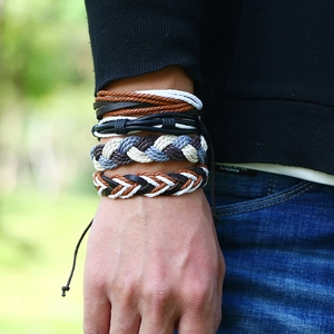 Close-up of multilayer braided leather bracelets for men with adjustable cords on wrist