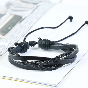 Detail of multi-layer braided black leather bracelet with adjustable sliding knot closure