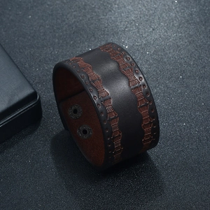 Retro dark brown wide leather bracelet with wavy stitching and adjustable metal snaps