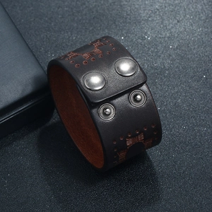 Vintage punk leather bracelet with embossed patterns and adjustable metal snap buttons