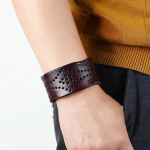 Men's retro wide leather bracelet featuring hollow-out patterns and vintage dark brown finish