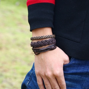 Men's retro braided multilayer leather bracelet set with brown woven cords on a wrist