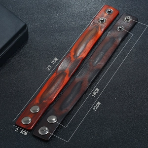 Retro punk style leather bracelet for men in orange and brown with adjustable metal snaps