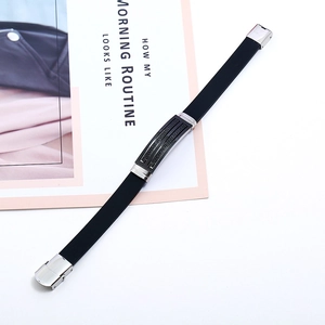 Men's minimalist black silicone bracelet with silver stainless steel geometric engraving