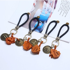 Braided leather keychain with twelve constellations charms and lucky wood pendants