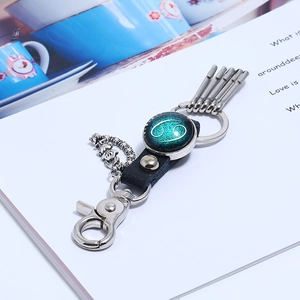 Leather zodiac keychain with Cancer sign glass cabochon and silver metal hardware