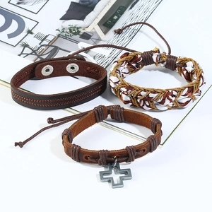Handmade vintage brown leather bracelet set with metallic cross charm and braided cords