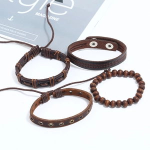 Set of 4 vintage braided leather bracelets with wooden beads and metal studs