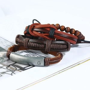 Vintage 4-piece multilayer leather bracelet set with brown beads and letter G metal plate