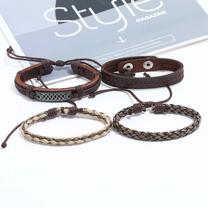 Vintage braided leather bracelet set for men featuring metal charms and hemp rope accents