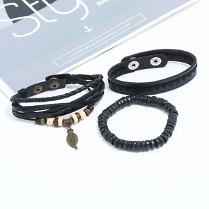 Three-piece black leather bracelet set with wooden beads and vintage leaf pendant