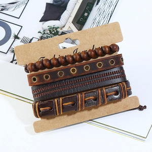 Set of four vintage braided leather and wooden bead bracelets on display card