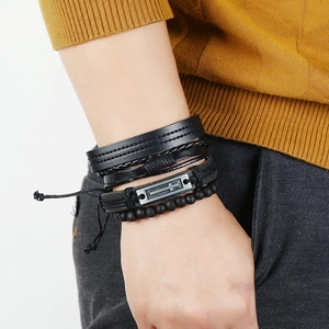 Men's multilayer leather bracelet set with vintage cross metal plate on knit background
