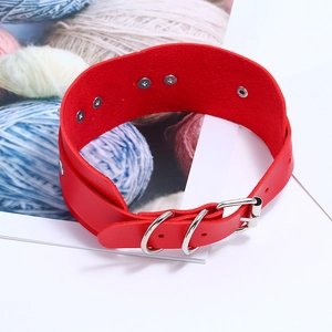 Detail of red punk leather choker featuring silver metal buckles and D-rings with studs