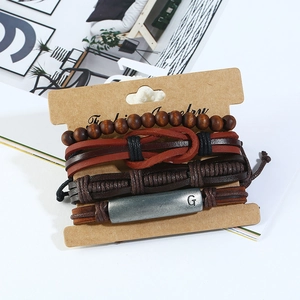 Retro 4-piece punk leather bracelet set with woven straps and metal G-letter tube charm