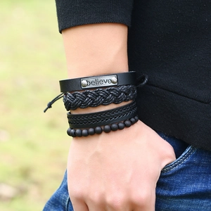 Set of 4 men's black leather bracelets with braided rope and 'believe' metal tag