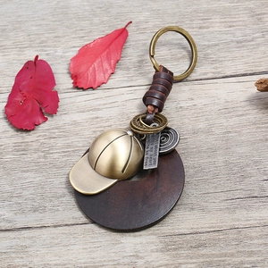 Retro punk braided leather keychain with bronze baseball cap and wooden charm