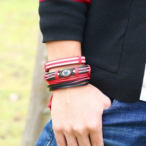 Handmade leather woven bracelet set for women featuring evil eye charm and boho style straps