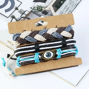 Three-piece braided leather bracelet set with Evil Eye charm on display card