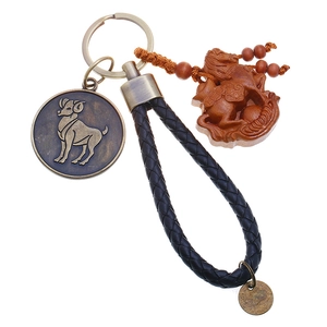 Braided leather zodiac keychain with Aries brass coin and mahogany horse wood carving
